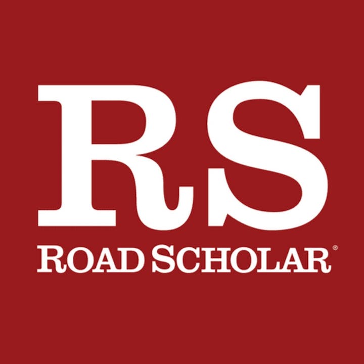 The image features the logo of "Road Scholar," with the letters "RS" prominently displayed in white on a red background.