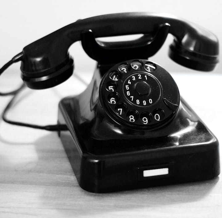 May contain: electronics, phone, and dial telephone