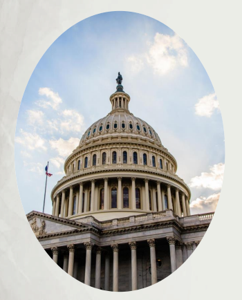 The United States Capitol dome under a partly cloudy sky.