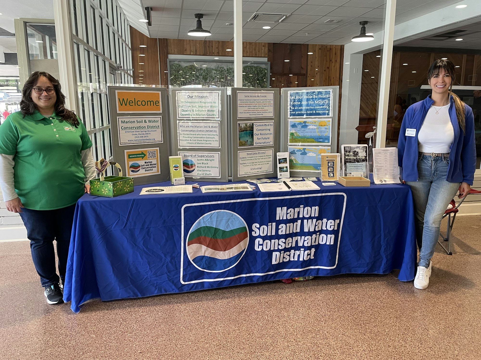 Two people at a Marion Soil and Water Conservation District information booth.