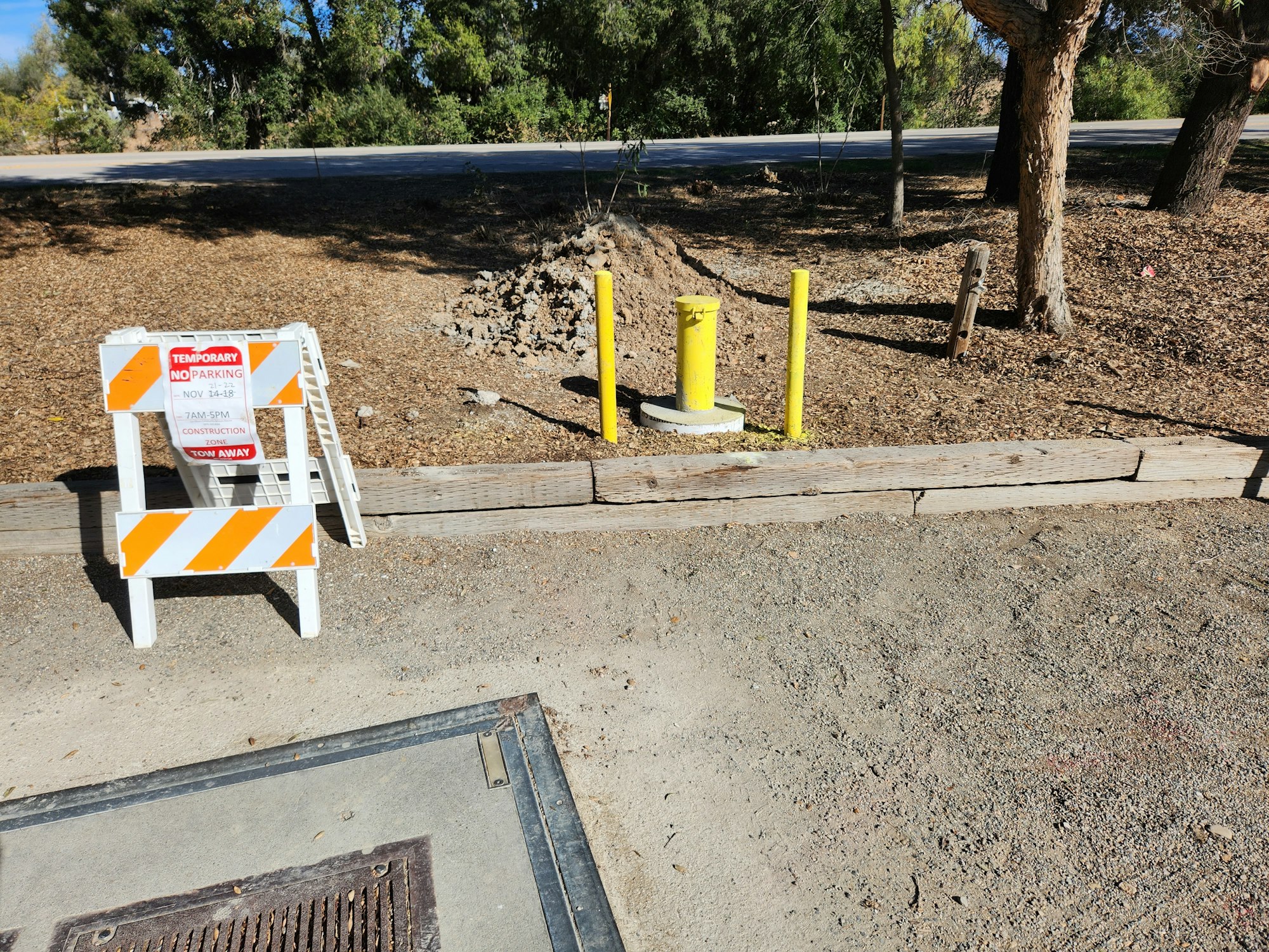 May contain: fence, tree, plant, path, wood, and road