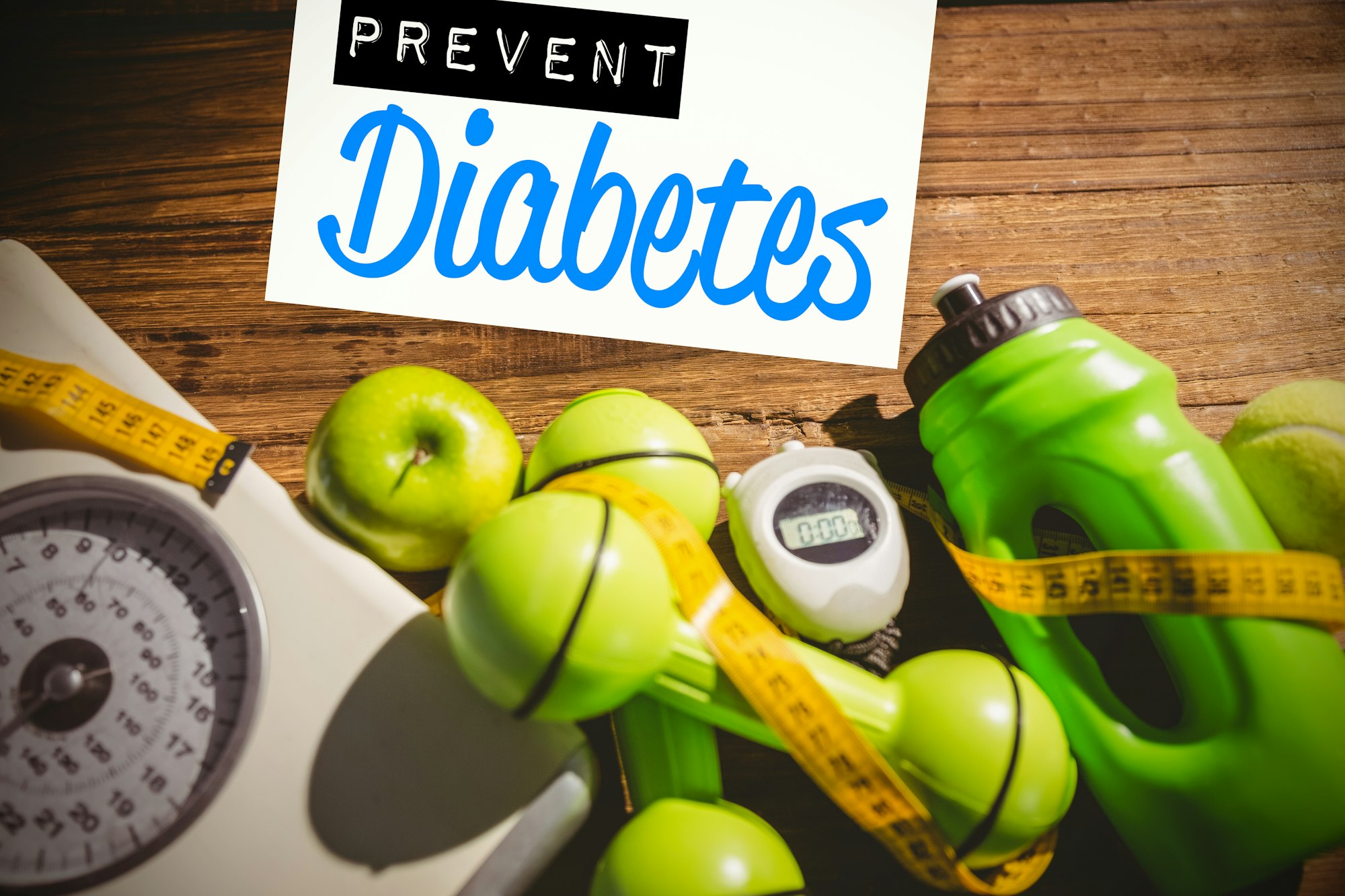 Scale, apples, dumbbells, tape measure, water bottle, stopwatch, "Prevent Diabetes" text.