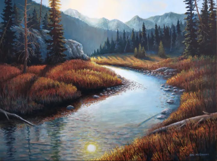 A serene river landscape with autumnal foliage, mountains in the background, and a clear sky.