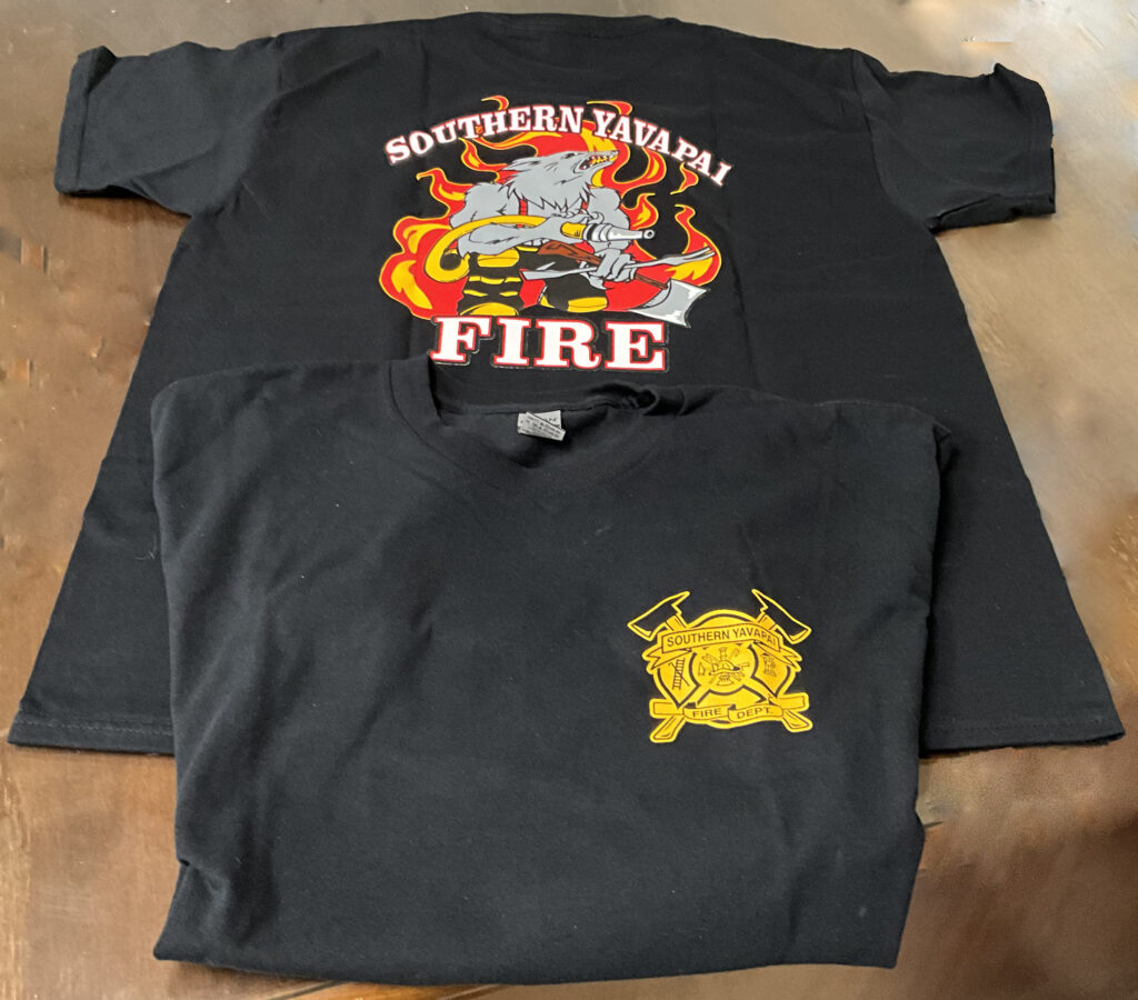 Two black T-shirts with Southern Yavapai Fire Department logos and graphics featuring flames and a mascot.