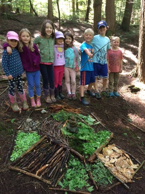 May contain: plant, vegetation, soil, grove, land, nature, outdoors, tree, woodland, face, head, person, photography, portrait, green, herbal, herbs, grass, park, leaf, jungle, clothing, footwear, shoe, shorts, hat, wilderness, boy, child, male, path, female, girl, rainforest, adventure, hiking, leisure activities, trail, yard, coat, rock, backyard, and pants