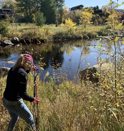 May contain: nature, outdoors, pond, water, photography, land, wilderness, plant, vegetation, face, head, person, portrait, tree, woodland, grove, grass, clothing, pants, adventure, hiking, and leisure activities