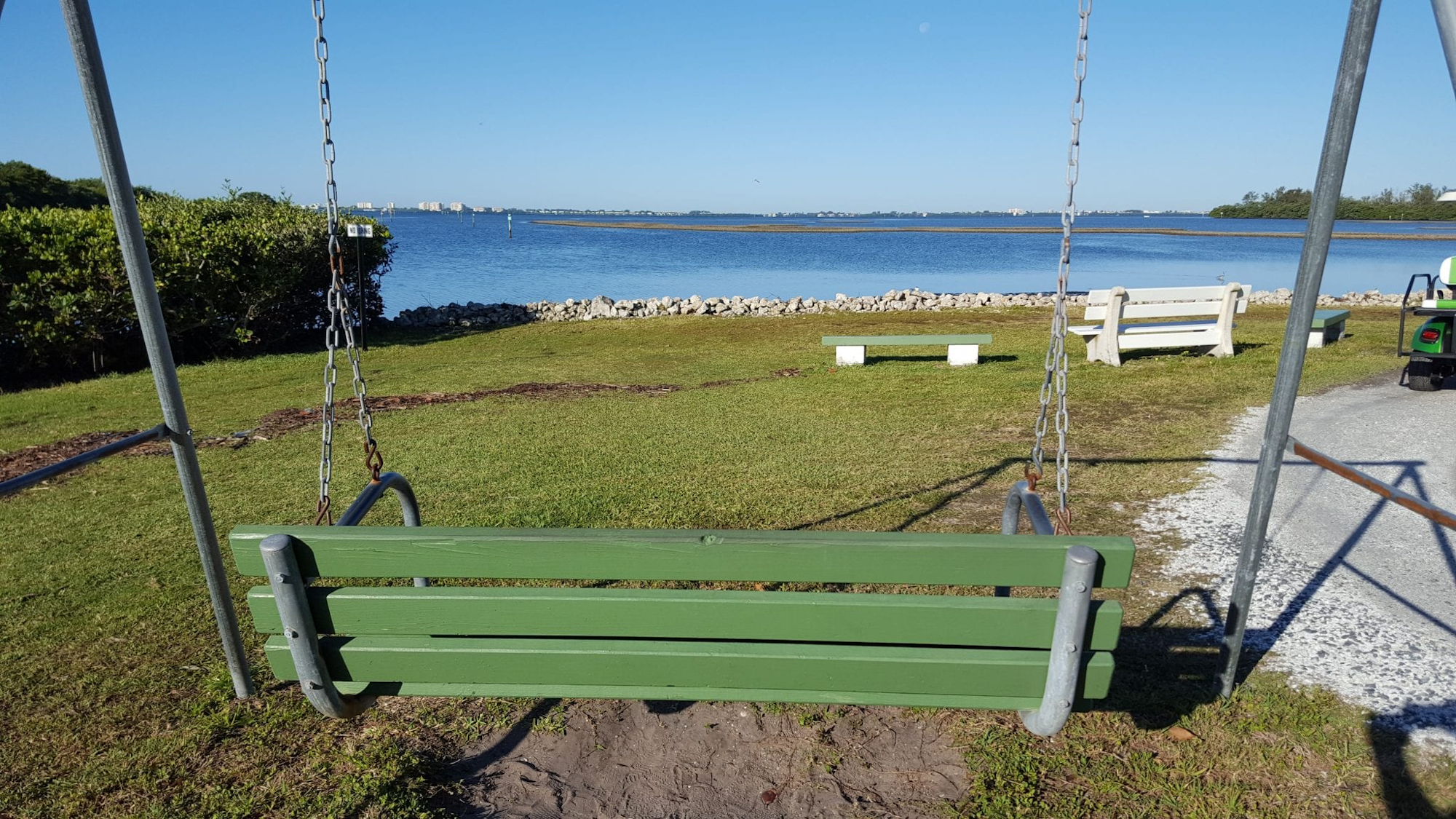Picture of the swing at the TE Beach over looking the bay