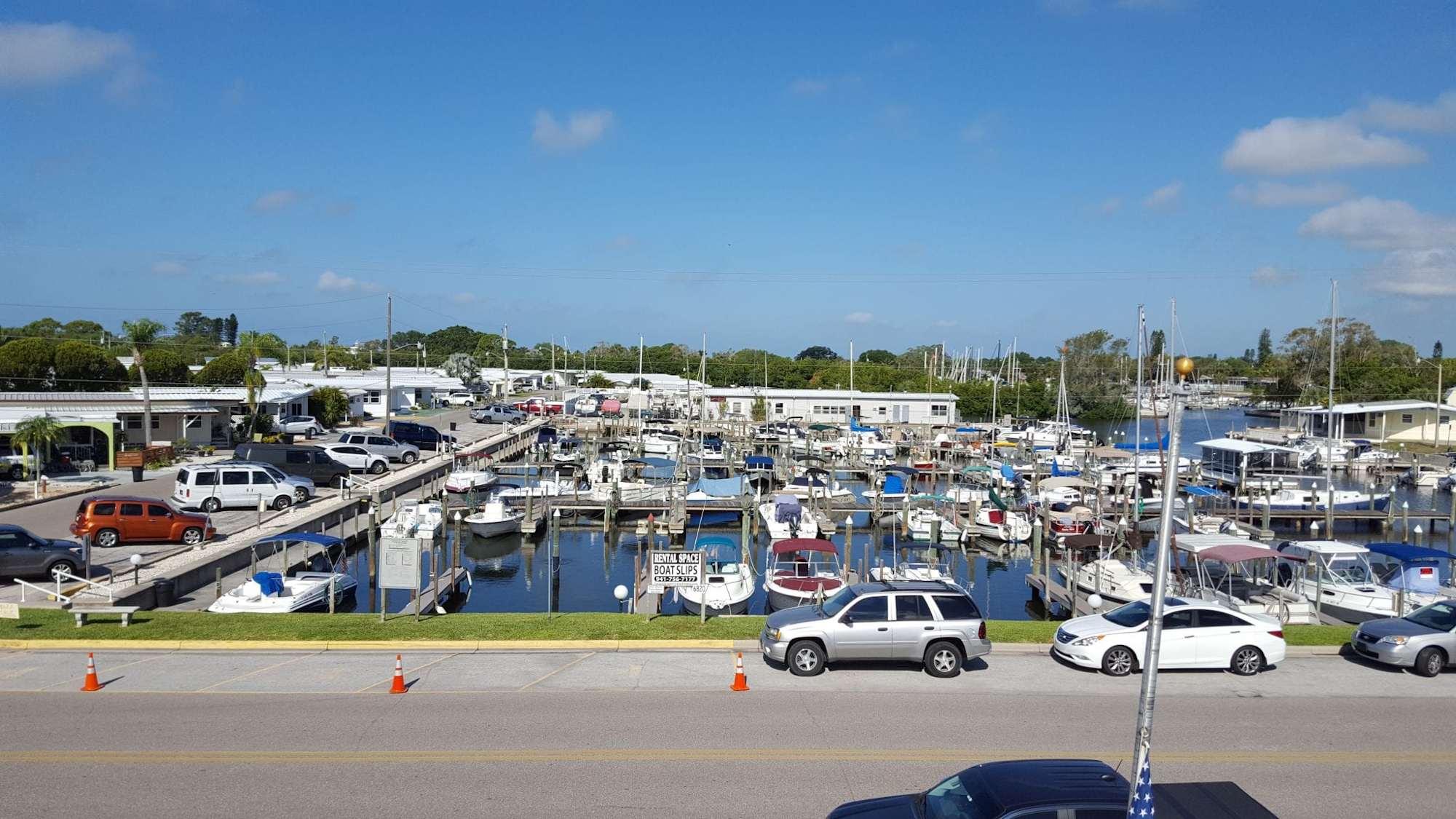 May contain: water, waterfront, harbor, pier, marina, port, car, transportation, vehicle, and boat