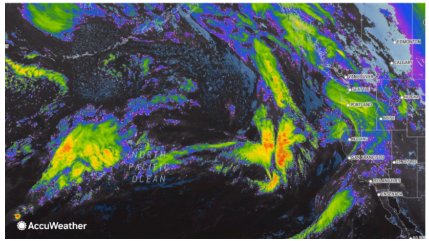 Satellite image of a weather system over the North Pacific Ocean, showing cloud formations approaching the US West Coast.