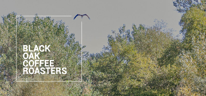 The image features a flying bird in a natural setting, with the text "BLACK OAK COFFEE ROASTERS" superimposed.