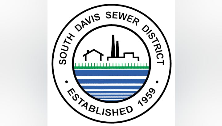 Logo of South Davis Sewer District with buildings, stripes, and text: "Established 1959."