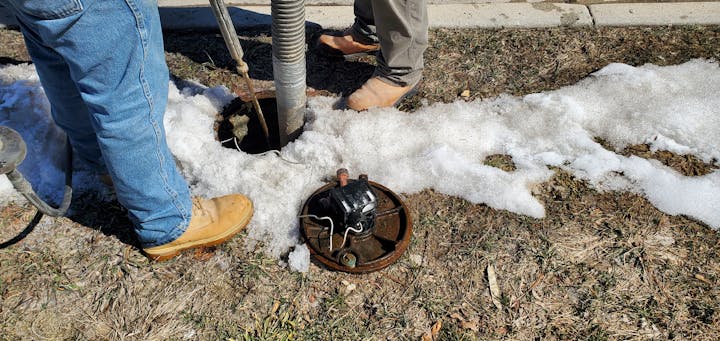 Water crew identifying water line material.