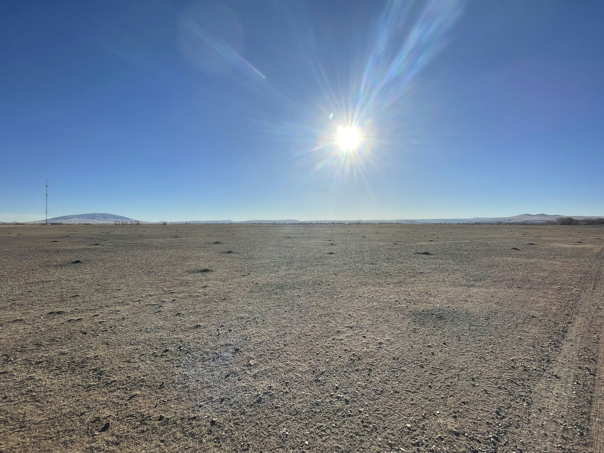May contain: nature, outdoors, sky, ground, horizon, sun, and scenery