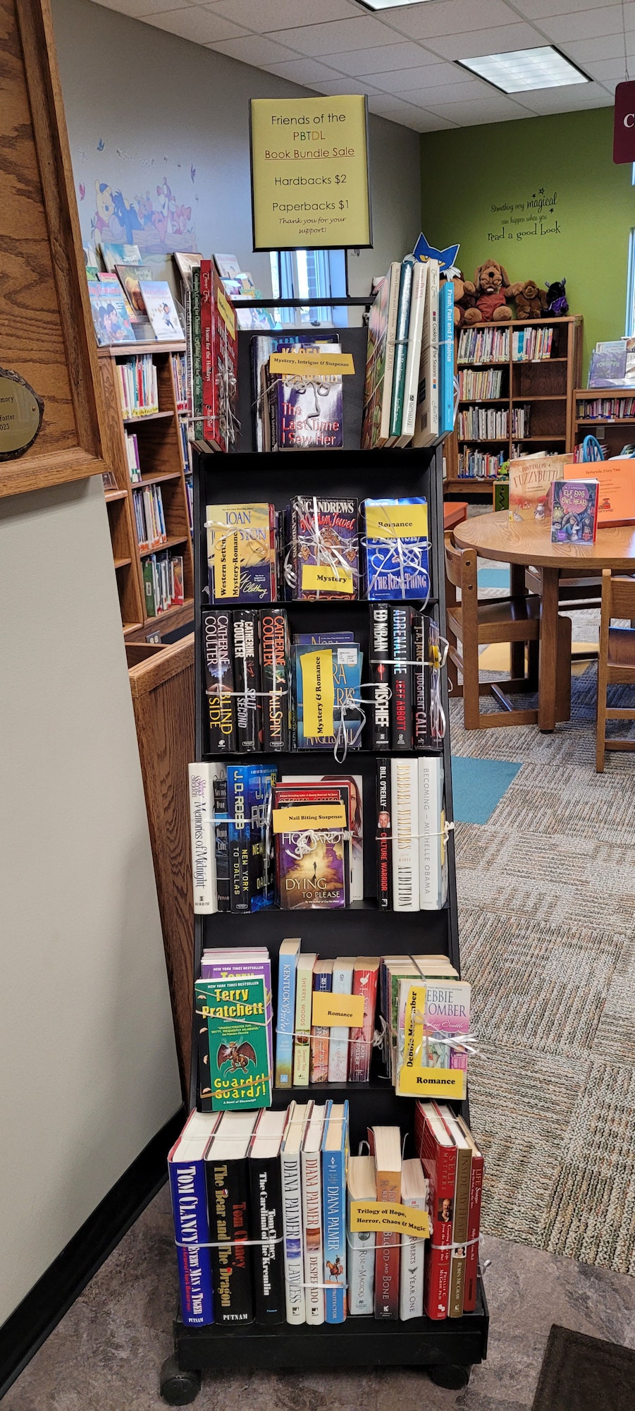 May contain: shelf, book, publication, chair, furniture, desk, table, indoors, library, and bookcase