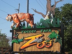 Potter Park Zoo sign featuring a tiger and a gorilla with leafy decorations.
