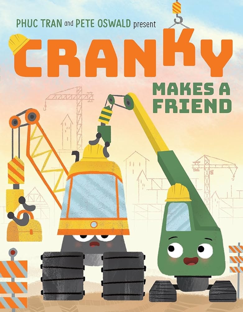 Two animated construction vehicles with faces on a book cover titled "Cranky Makes a Friend."