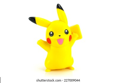 A Pikachu toy figure with a cheerful expression, isolated on a white background.