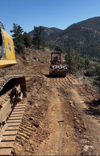 May contain: soil, bulldozer, machine, nature, and outdoors