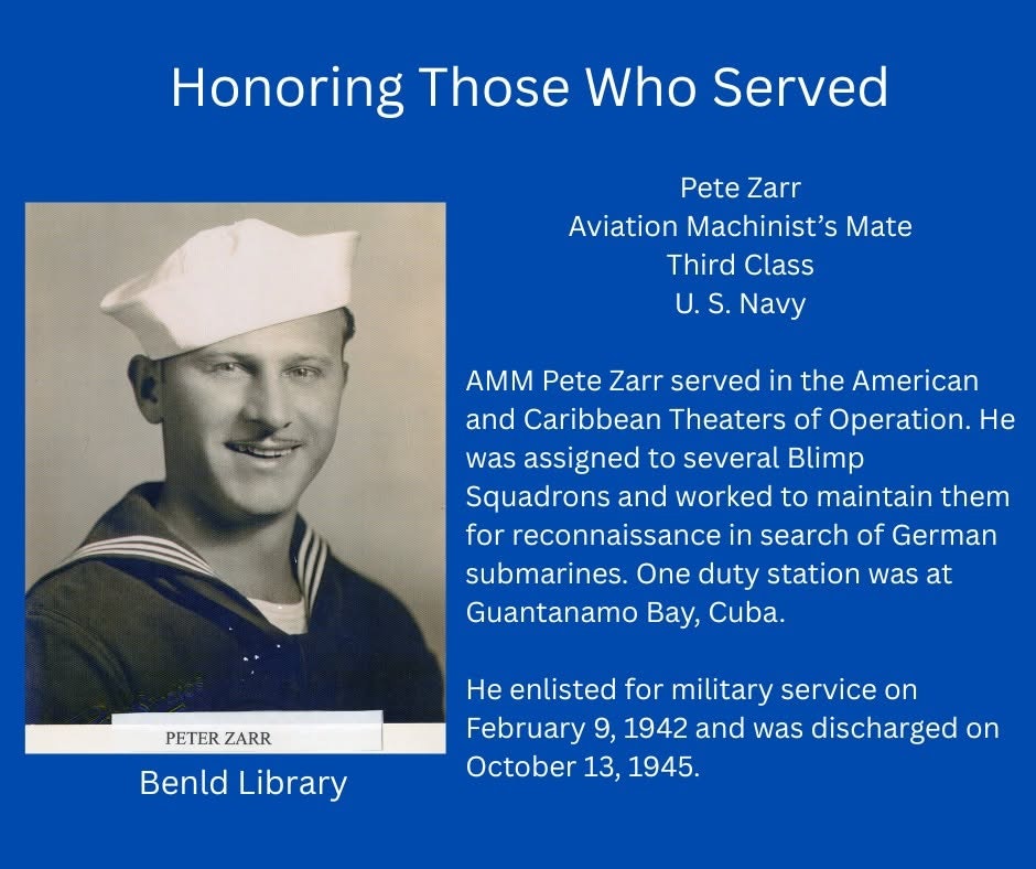 The image honors Pete Zarr, a U.S. Navy Aviation Machinist's Mate who served from 1942-1945, focusing on blimp reconnaissance.