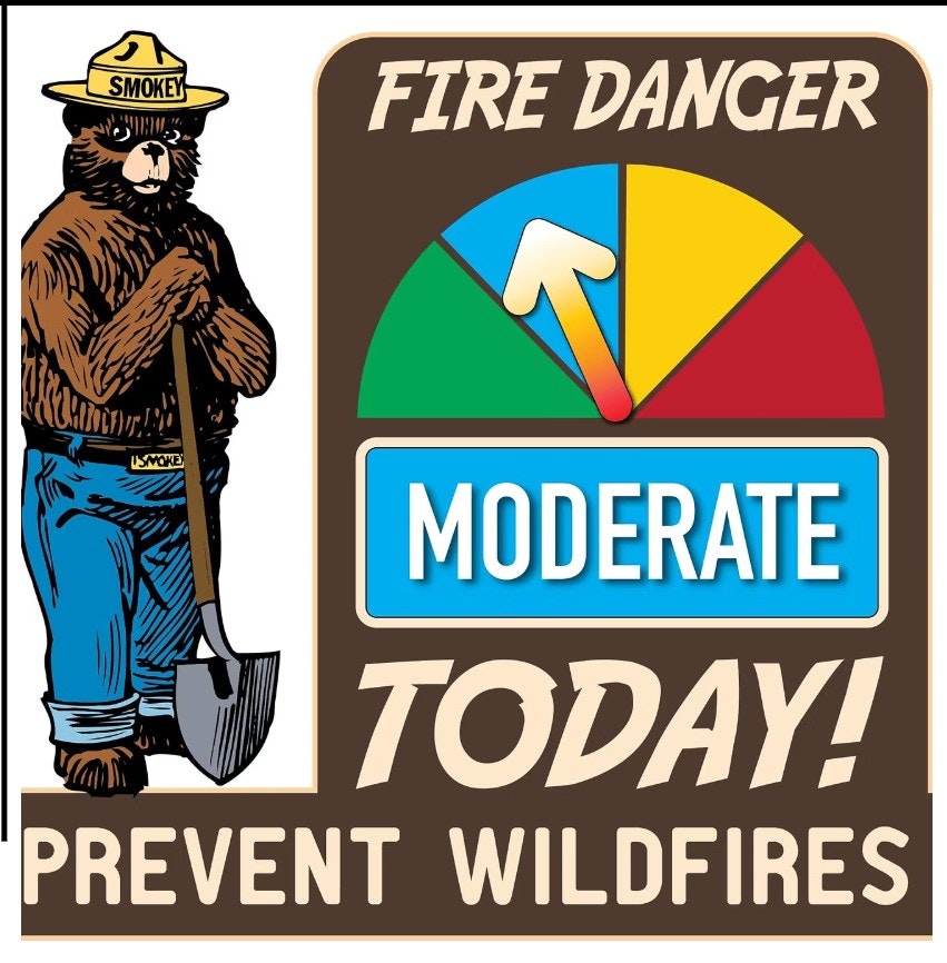 The image features Smokey Bear promoting wildfire prevention, indicating a "Moderate" fire danger level today.