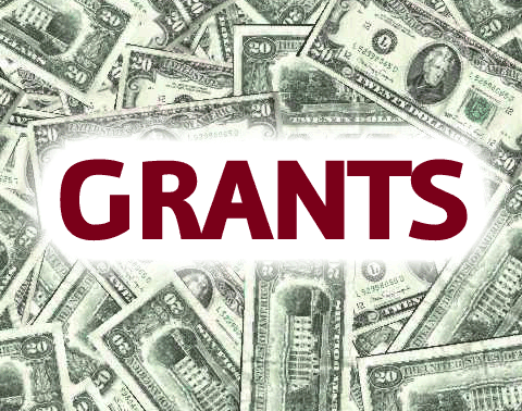US dollar bills with the word "GRANTS" overlaid.