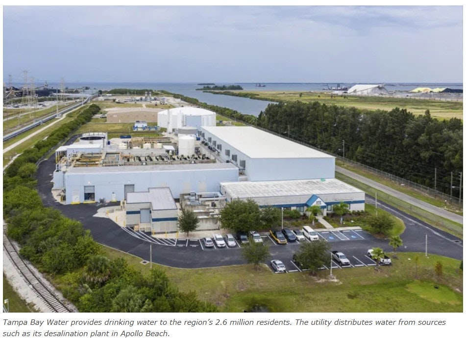 Aerial view of a large desalination plant with parking and adjacent water sources.