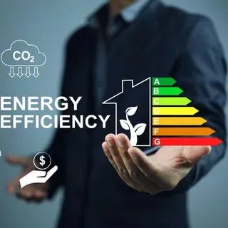 A person in a suit presenting icons depicting energy efficiency, savings, and CO2 reduction.