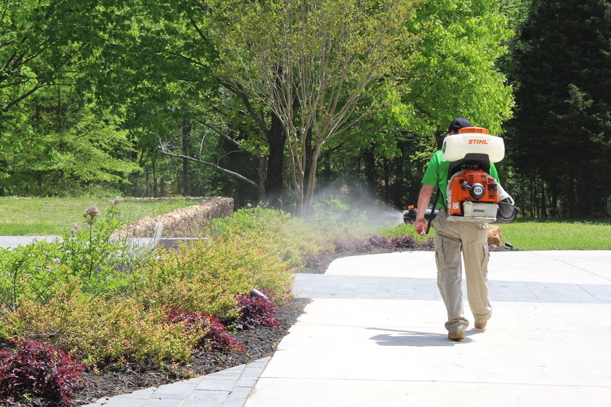 A person with spraying mosquito pesticide .