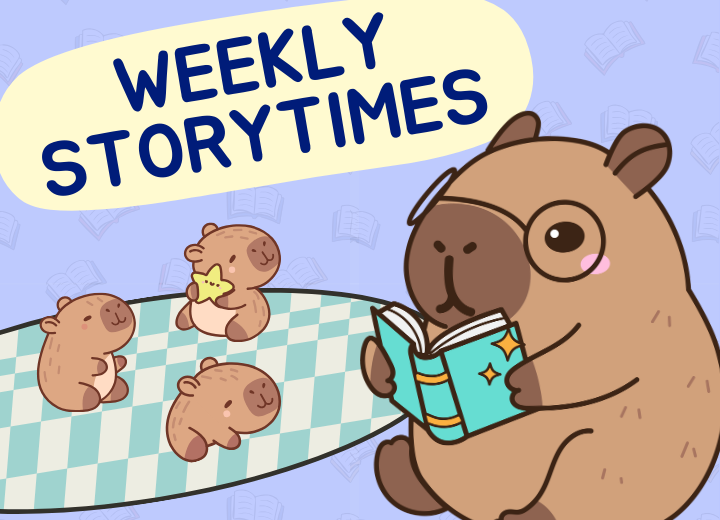 A capybara reads to three baby capybaras. Text: "Weekly Storytimes." Background: books on a blue pattern.