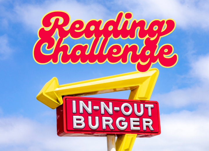 A sign saying "Reading Challenge" above an "IN-N-OUT BURGER" sign with a yellow arrow set against a blue sky.