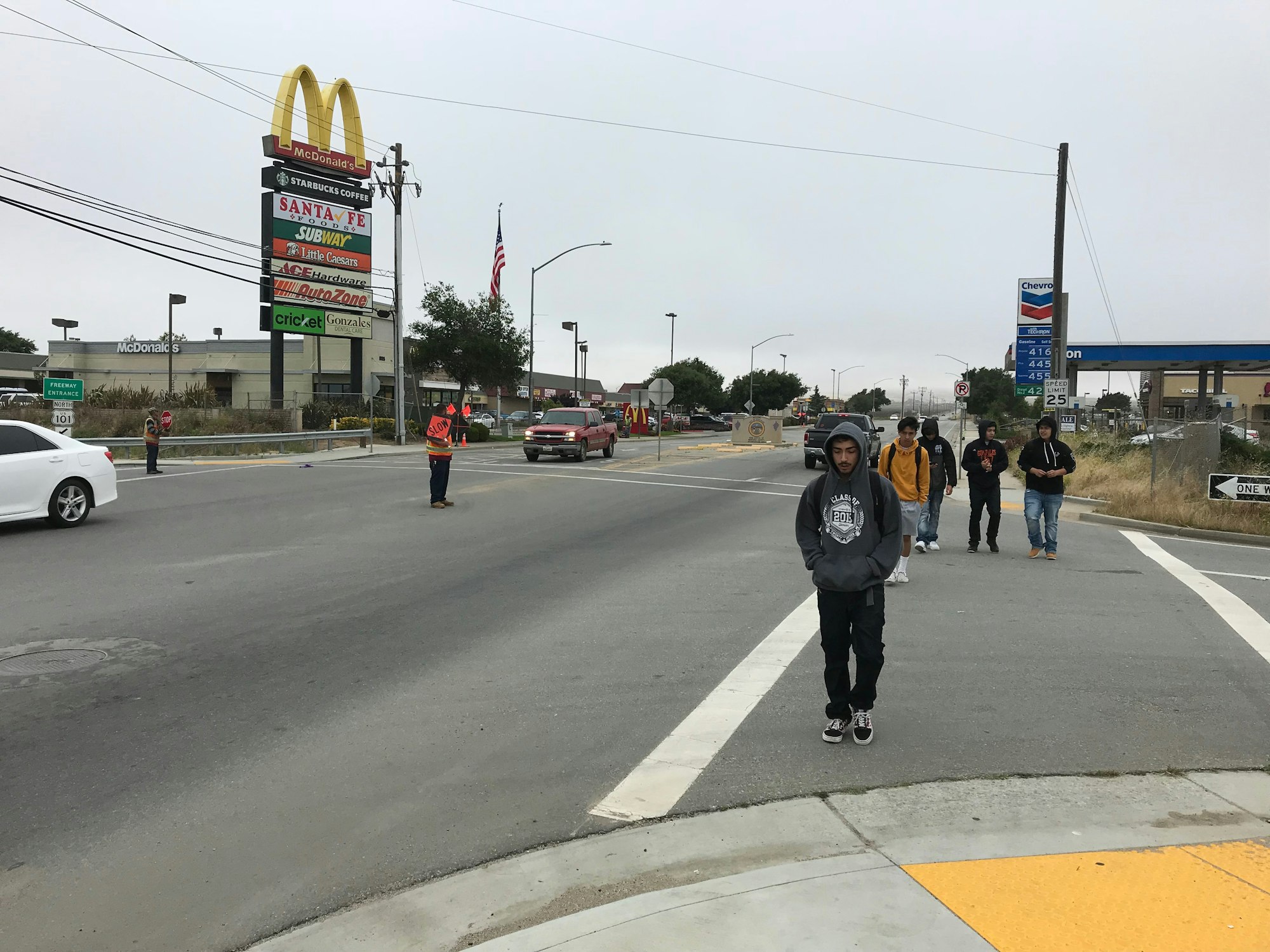 May contain: road, human, person, intersection, asphalt, tarmac, pedestrian, and freeway