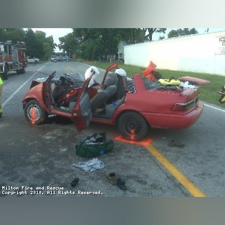 Photo of a red car after an accident