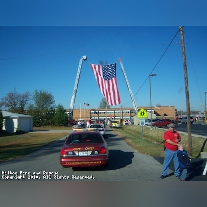 Photo of cars and an American flag