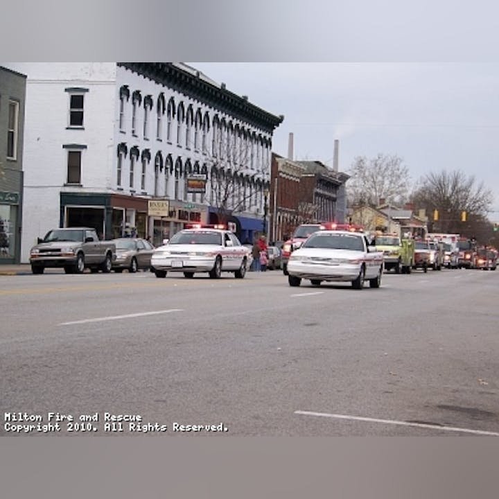 Photo of cars with emergency lights on in a street