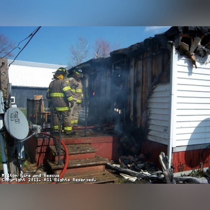Photo of firefighters at a house fire