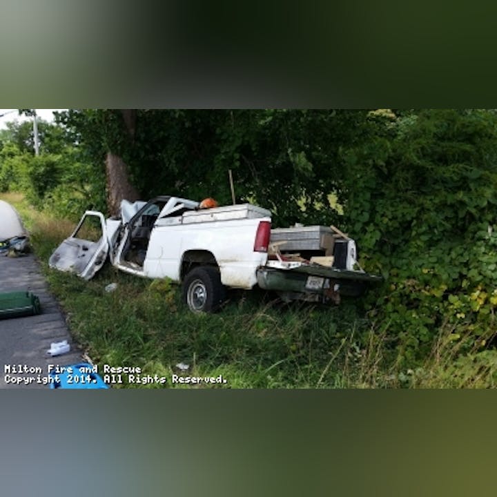 Photo of a truck after crashing into a tree