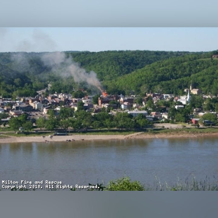 Photo of a building fire as seen from across a body of water