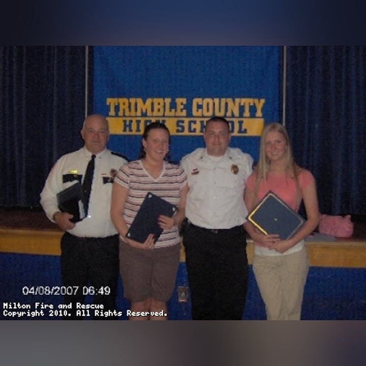 Photo of people holding awards or diplomas