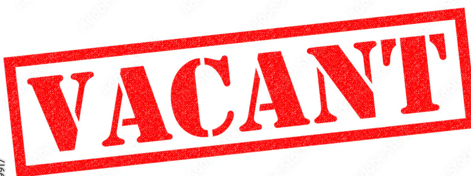 The image features a stamp with the word "VACANT" in bold red letters, indicating a space is unoccupied or available.