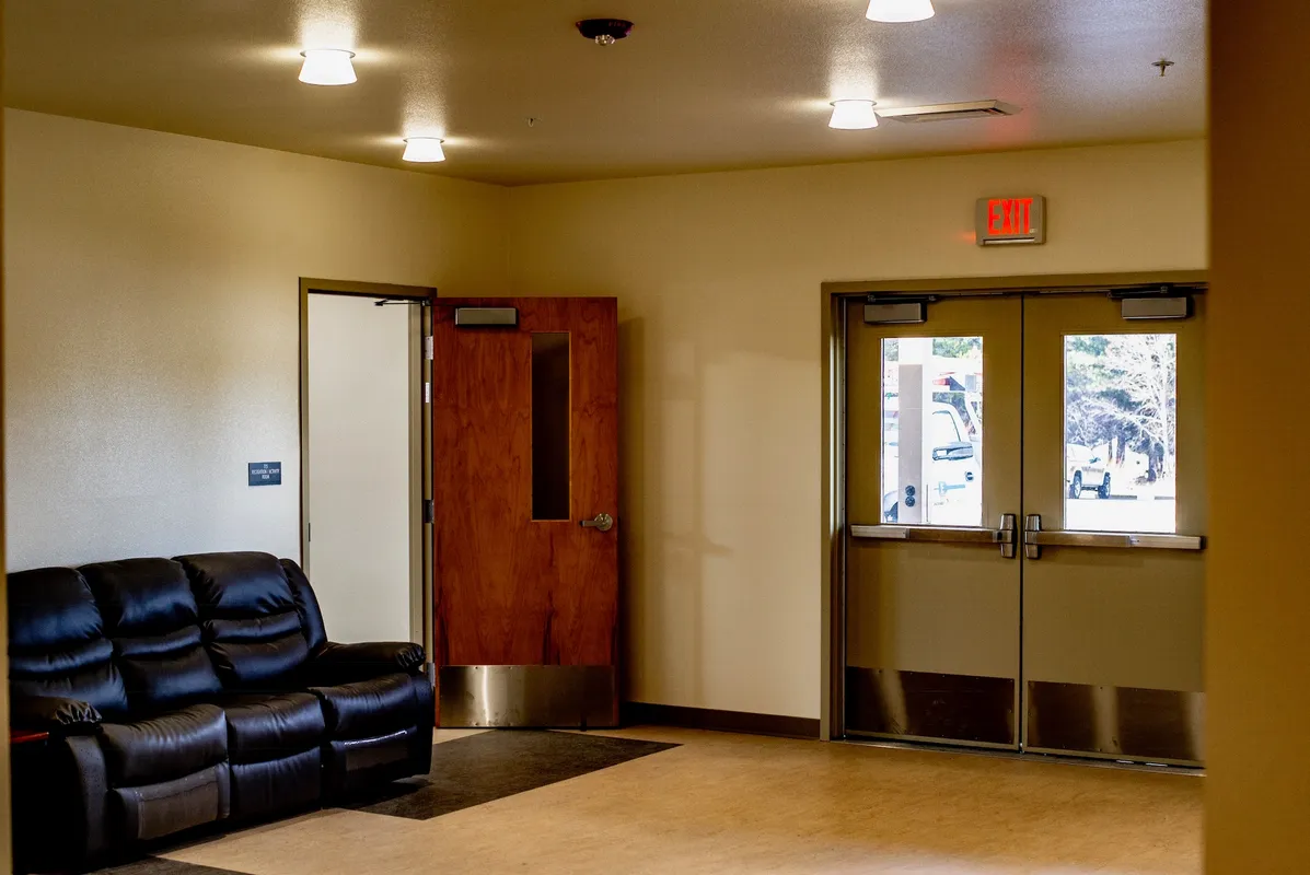 May contain: flooring, floor, couch, furniture, and door