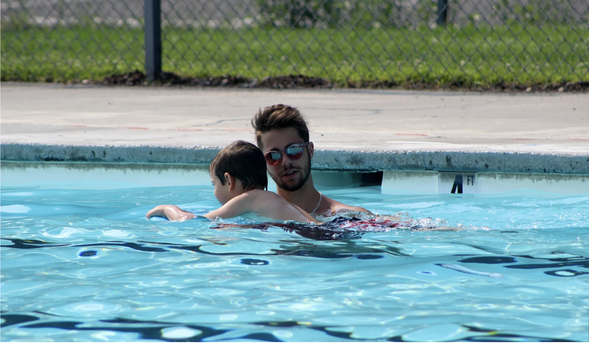 May contain: water, pool, sunglasses, accessories, accessory, person, human, and swimming pool