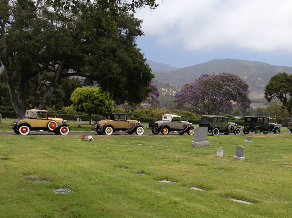 Photo of antique cars in a cemetery