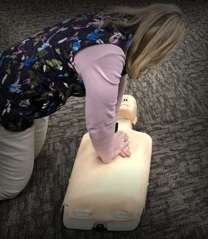 person performing chest compressions for CPR