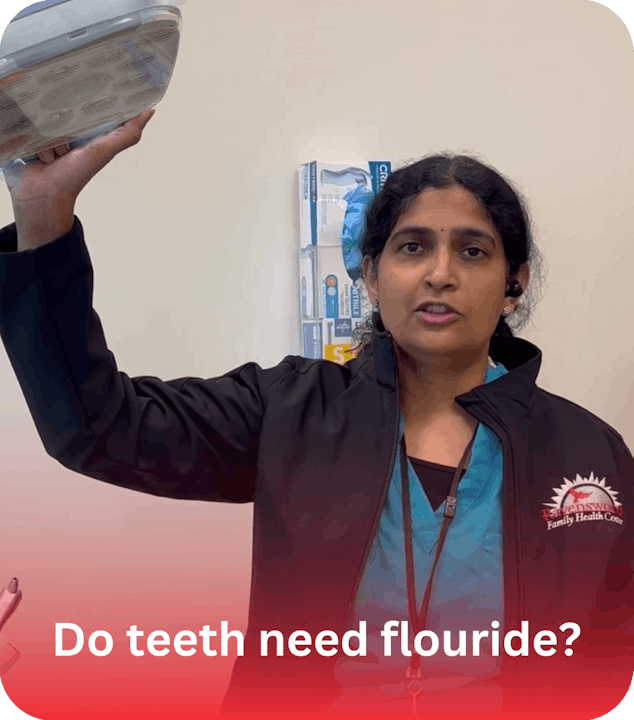 A person in a medical setting holding a light, with text asking, "Do teeth need fluoride?"