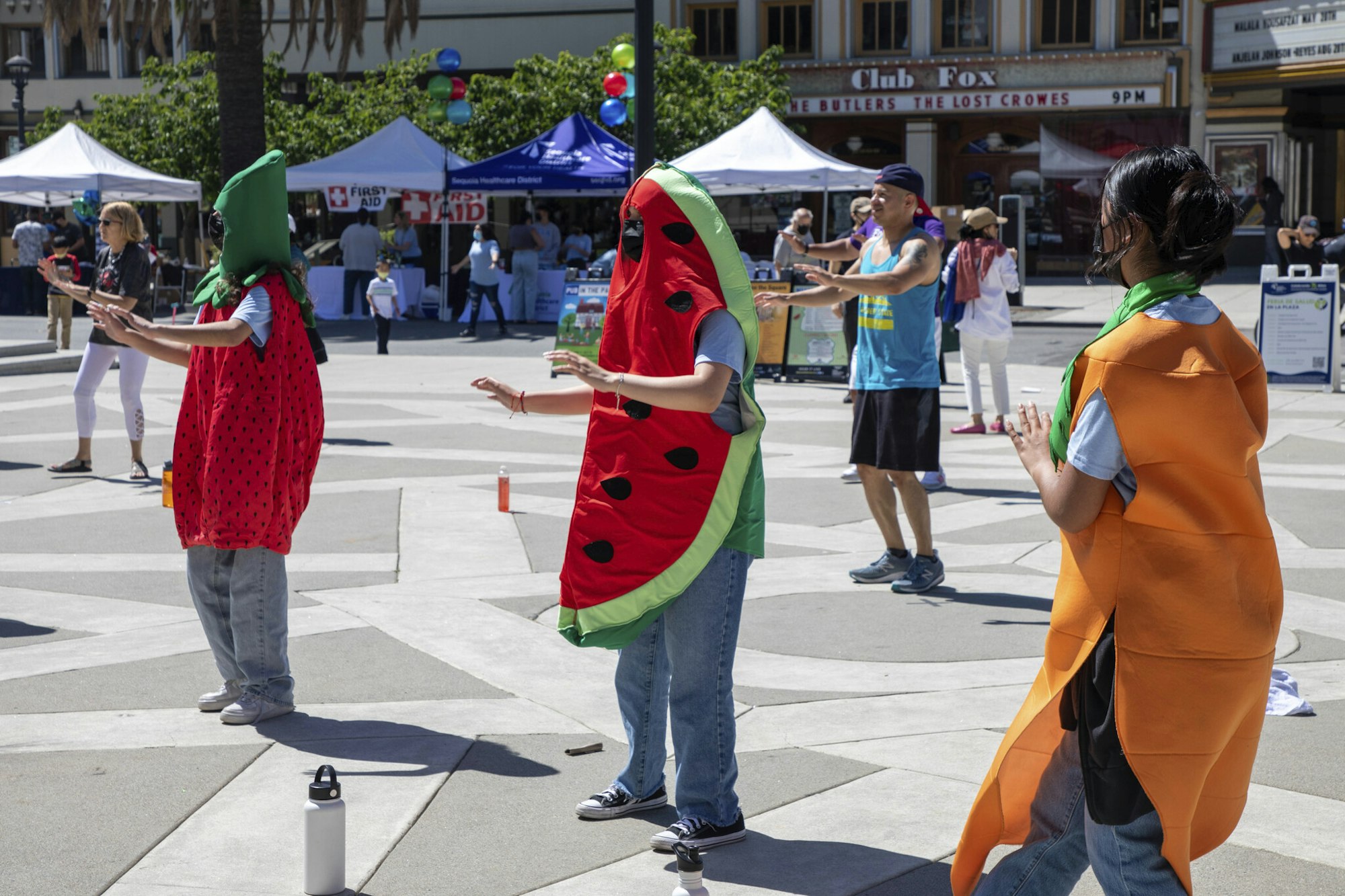 students in fruit costumes at the health fair