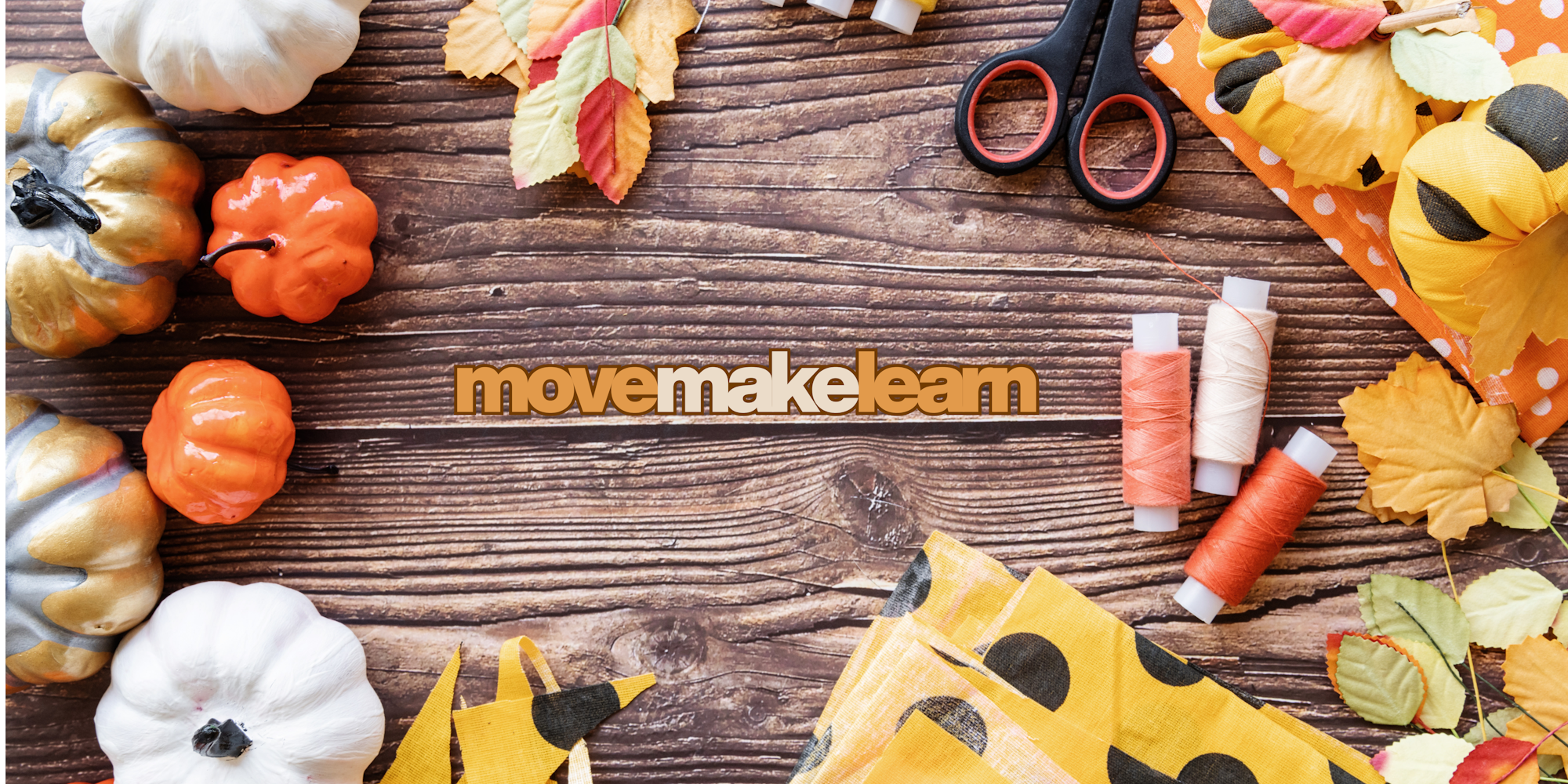 Autumn crafts table with pumpkins, scissors, thread and fabric scraps, quote "move make learn"