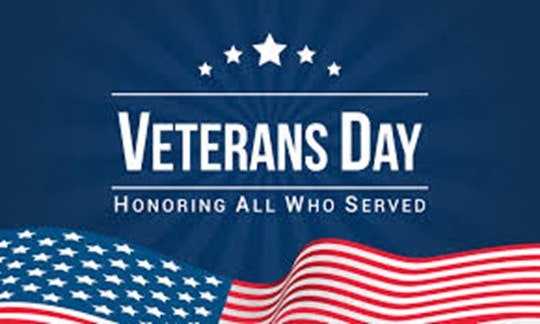 Veterans Day image with American flag and the words "Honoring All Who Served"