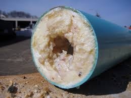 Photo of a drain pipe clogged with grease