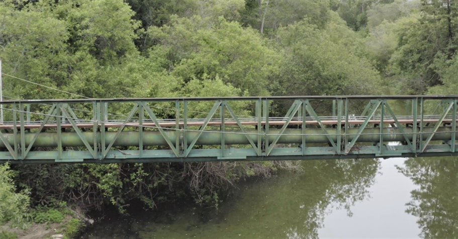 May contain: building, bridge, land, nature, outdoors, and water