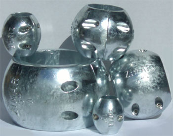 Shiny metal whisker pads with ball bearings, likely machinery parts.